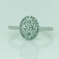 FR2197 18CT WG CLAW SET CLUSTER DIAMONDS IN OVAL SHAPE RING TDW= 0.59CT