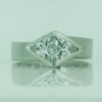 FR1202HN 9CT W/G BEZEL SET TWO TRIANGULAR CZ HAND MADE RING