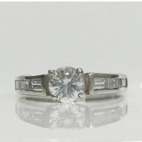 RING12 SILVER 4 CLAW SET RD.CZ ON CHANNEL SET BAG.CZ BAND
