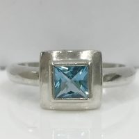 RING70 SILVER BEZEL SET SQUARE TOPAZ RING