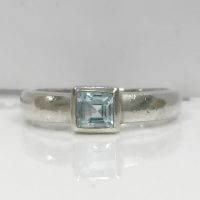 RING97 SILVER BEZEL SET SQUARE TOPAZ RING